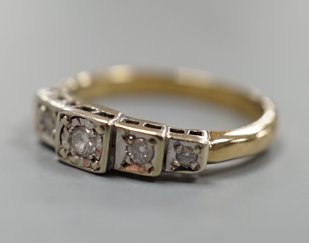 A yellow metal and graduated illusion set five stone diamond half hoop ring, size M/N, gross weight 3.2 grams.